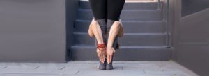 Kathy Jalali Forward Bend Pose In Front of Steps