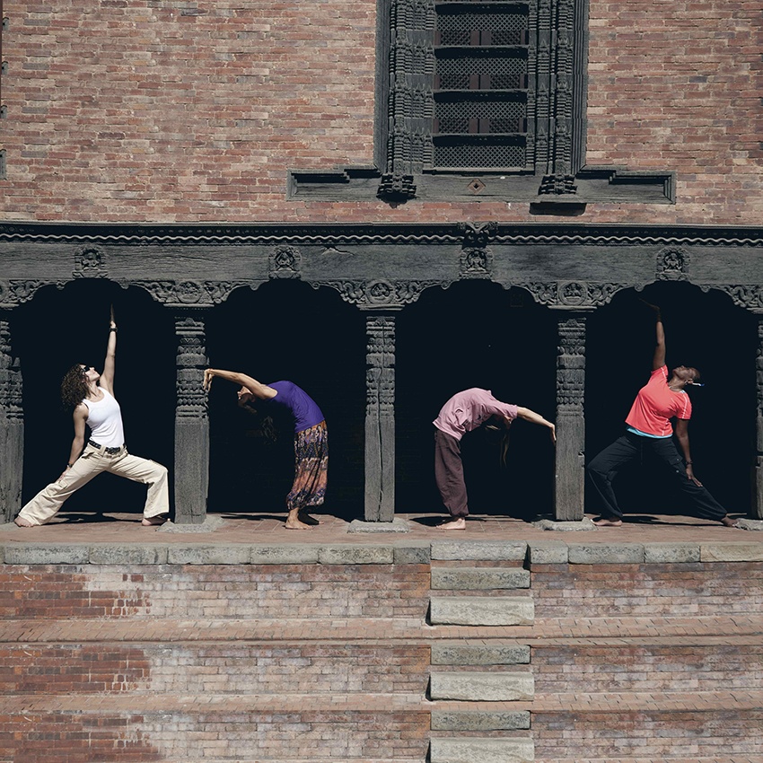 Yoga Poses Between Pillars in Nepal